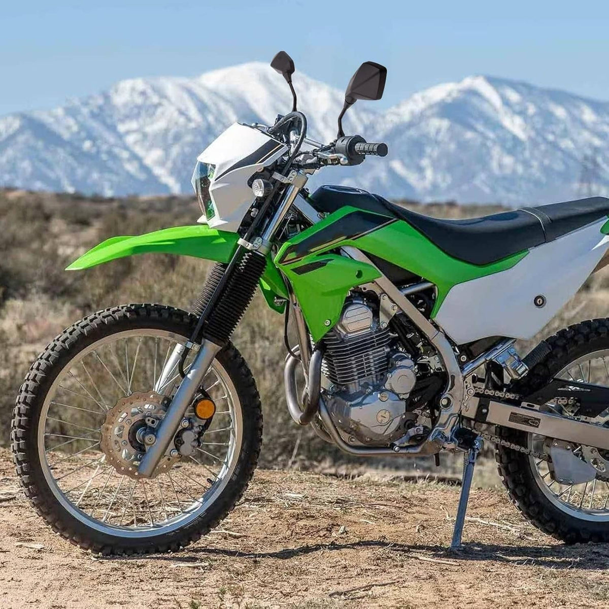 Green dirt bike with handlebar rear-view mirrors and black mirror housings