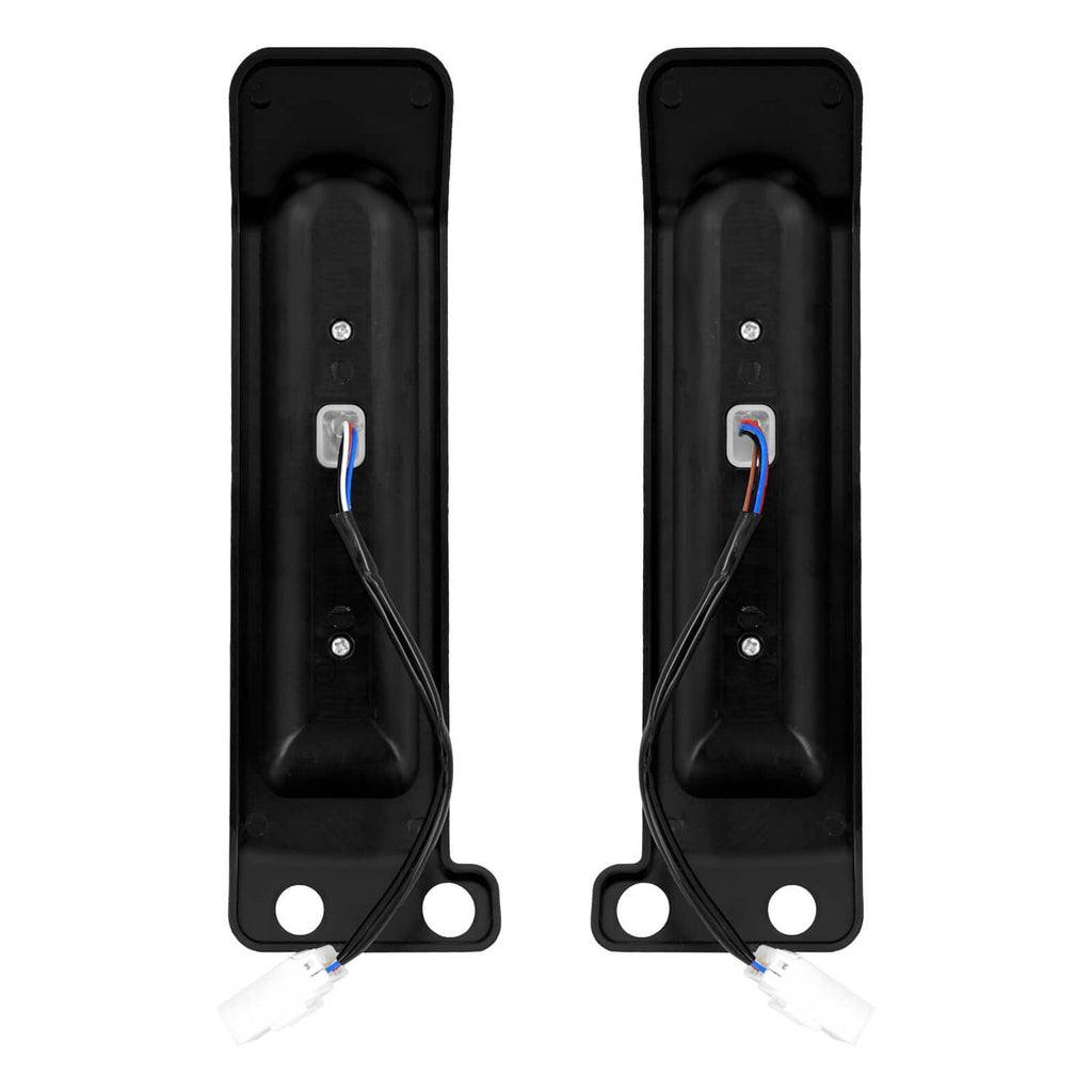 Black LED saddlebag filler lights with wiring leads and two mounting holes (pair).