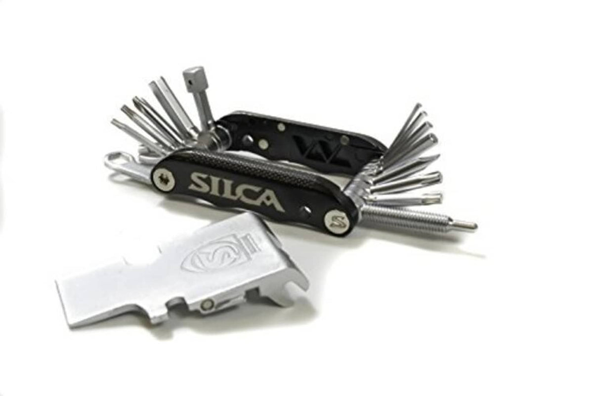 SILCA multi-tool with black handle and open tools, including silver flat blade attachment