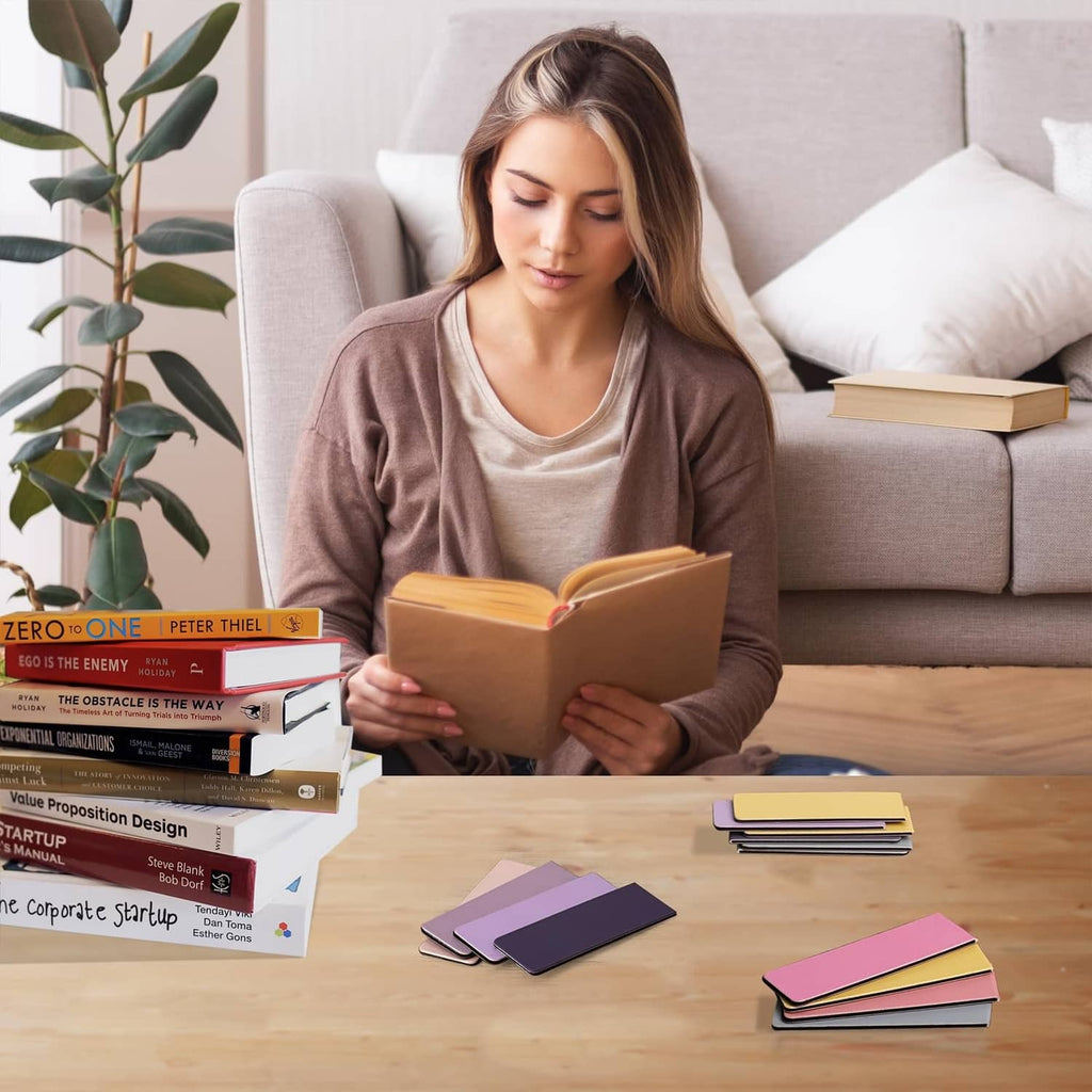 Color magnet bookmarks, stacked tabs on table beside an open book