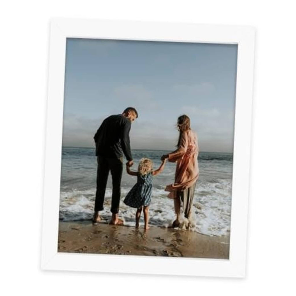 White 8x10 picture frame with clear glass front and solid wood border