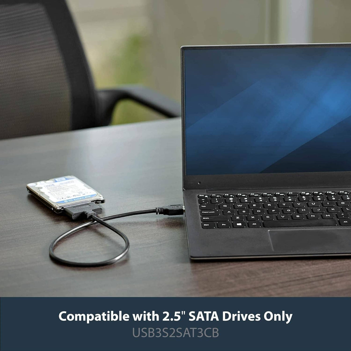 USB cable connecting a 2.5-inch SATA drive to a laptop, black connectors