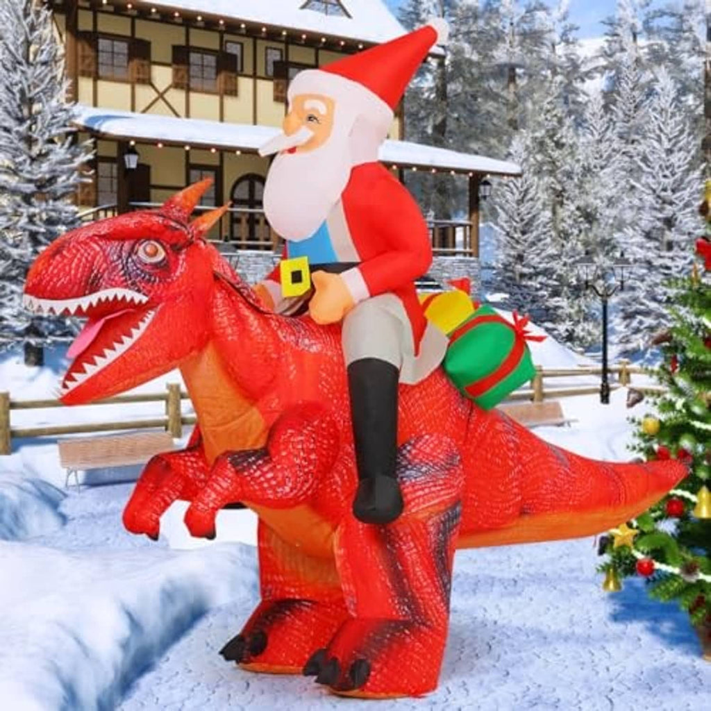 Inflatable Santa riding a red dinosaur with open jaws, red suit and black boots