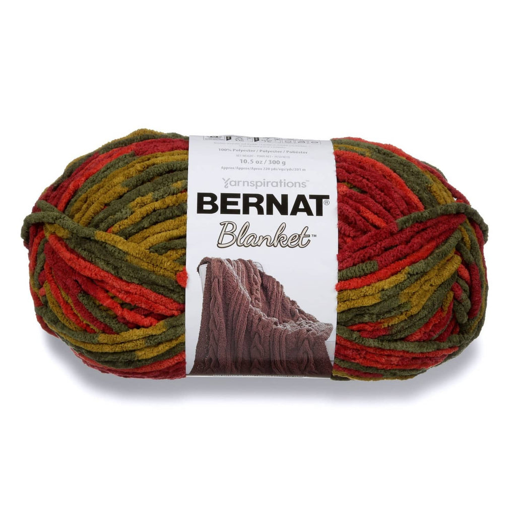 Soft chenille super bulky yarn skein in red, green, and yellow stripes with label