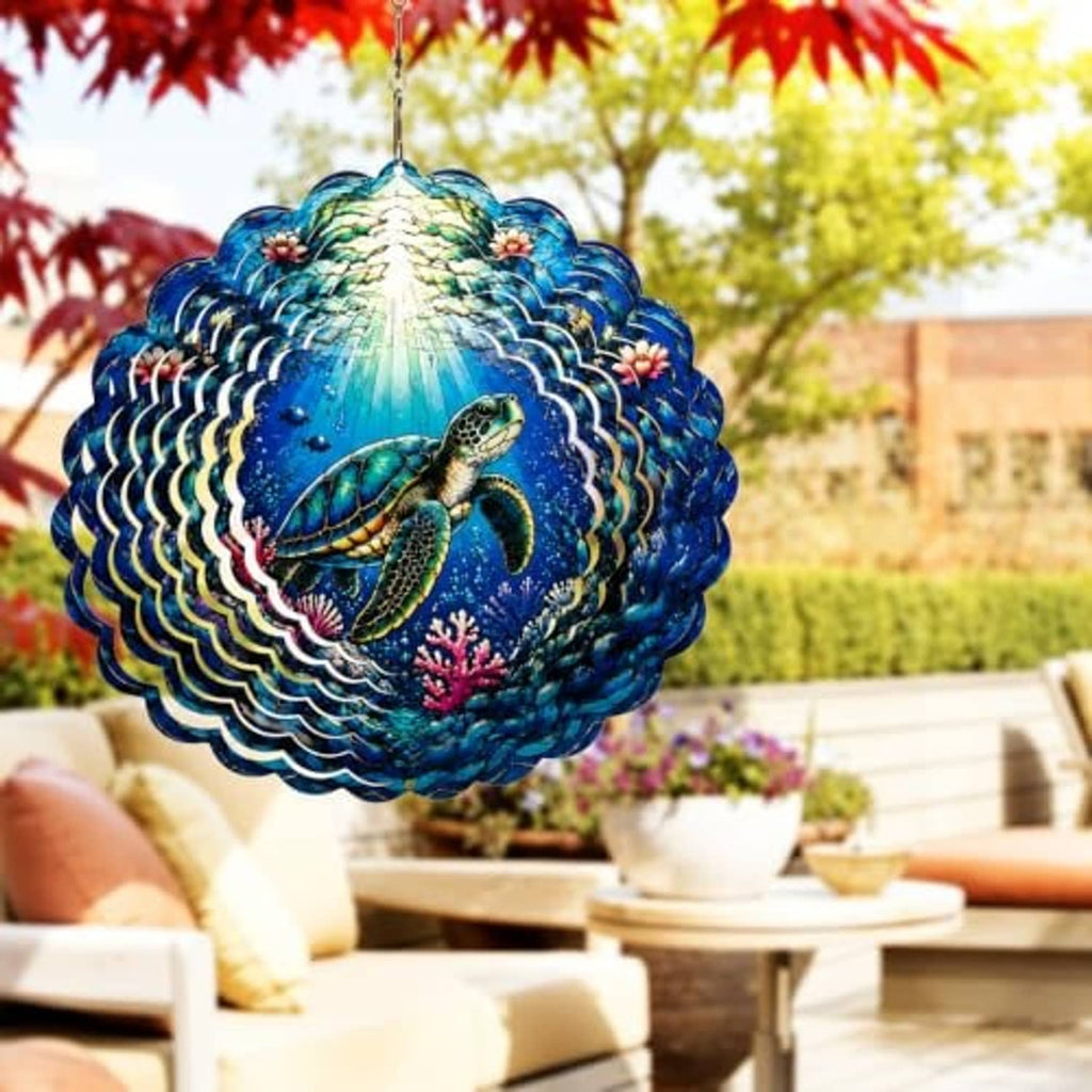 Blue sea turtle wind spinner outdoors with layered wave pattern and hanging hook