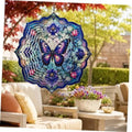 Purple and blue hanging butterfly wind spinner with ornate mandala ring design