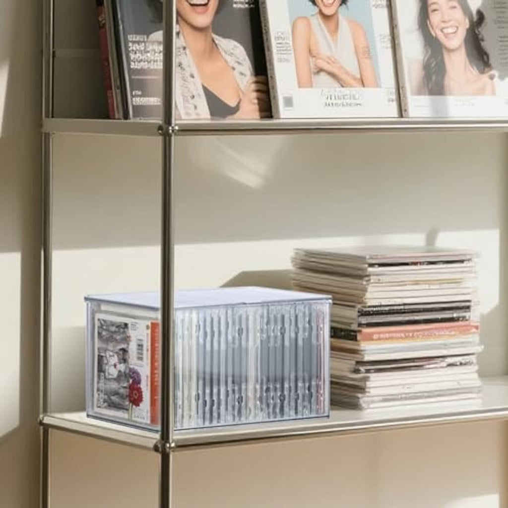 Clear plastic CD storage box on a shelf, CDs visible through transparent front