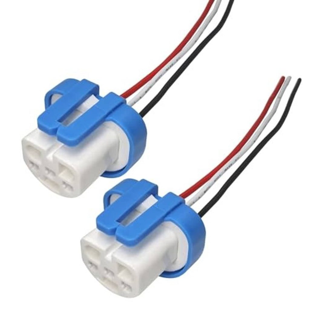 Two female ceramic connector adapters with blue caps and red/black wire leads, close-up view.