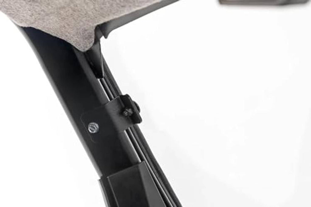 Black windshield support arm and mounting bracket with bolts