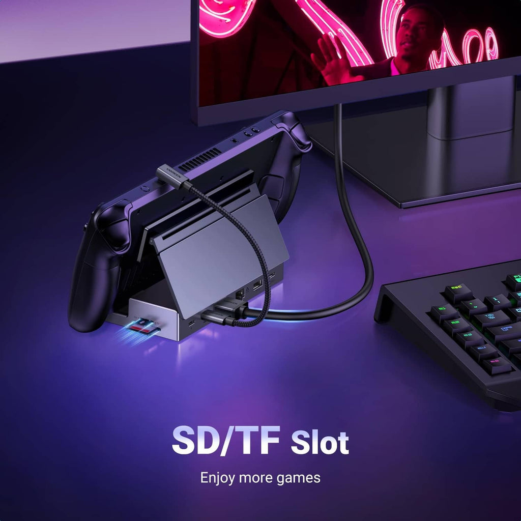 Grey USB-C docking station with foldable stand and connected cables for Steam Deck
