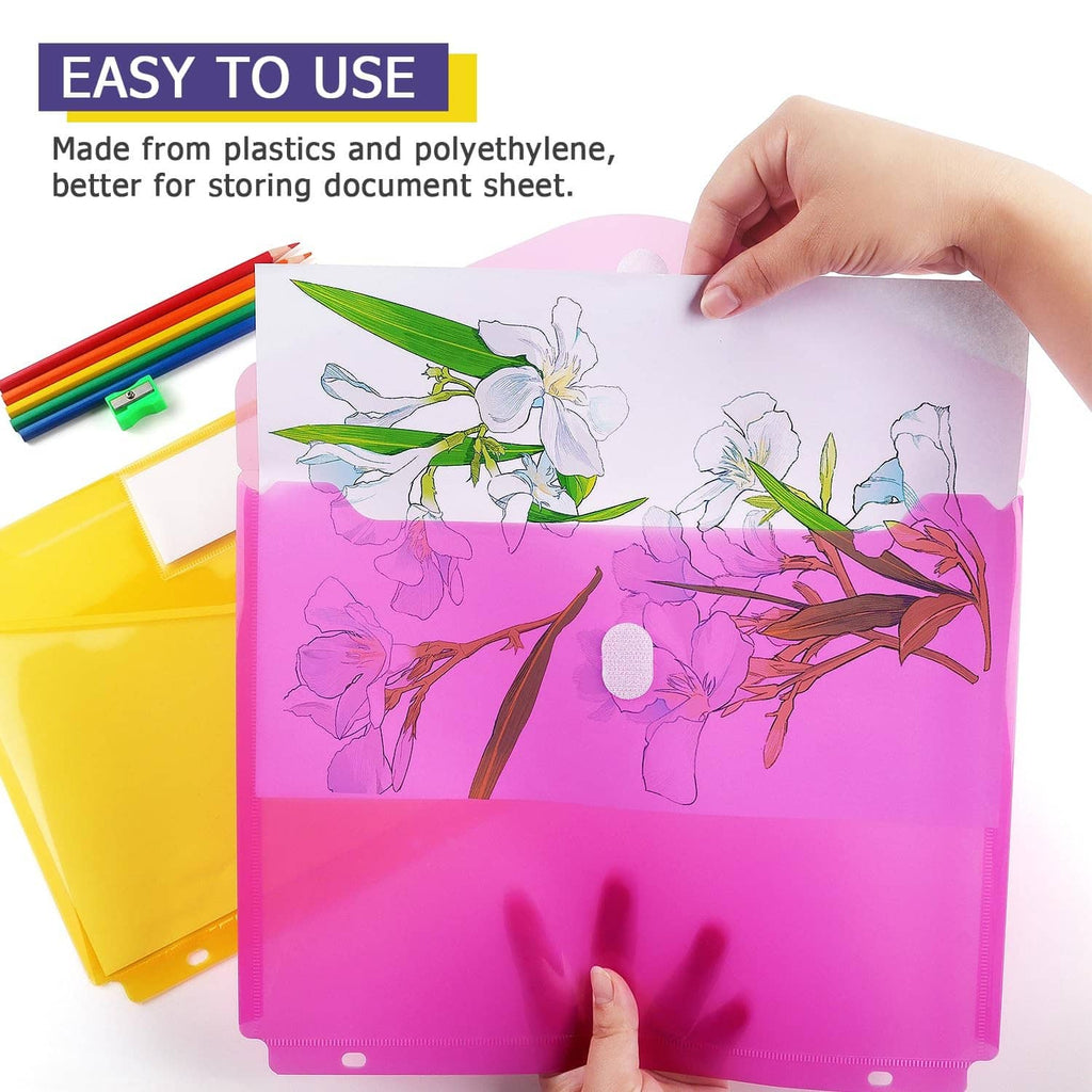 Pink plastic binder pocket folder being filled with papers, showing front label pocket and buttons