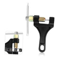 Motorcycle chain breaker tool with black handle and brass screw pin, side view