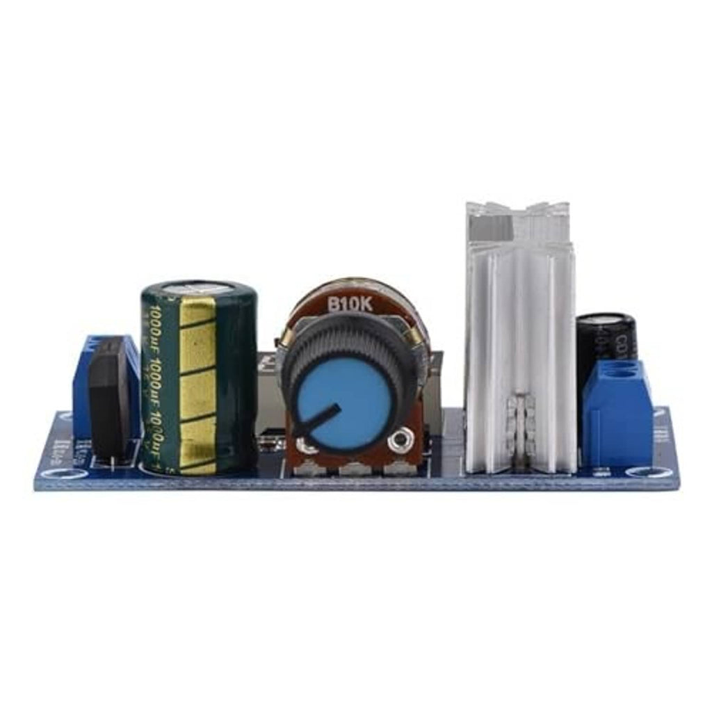 Voltage regulator module with blue PCB, tall aluminum heatsink, electrolytic capacitors, and knob