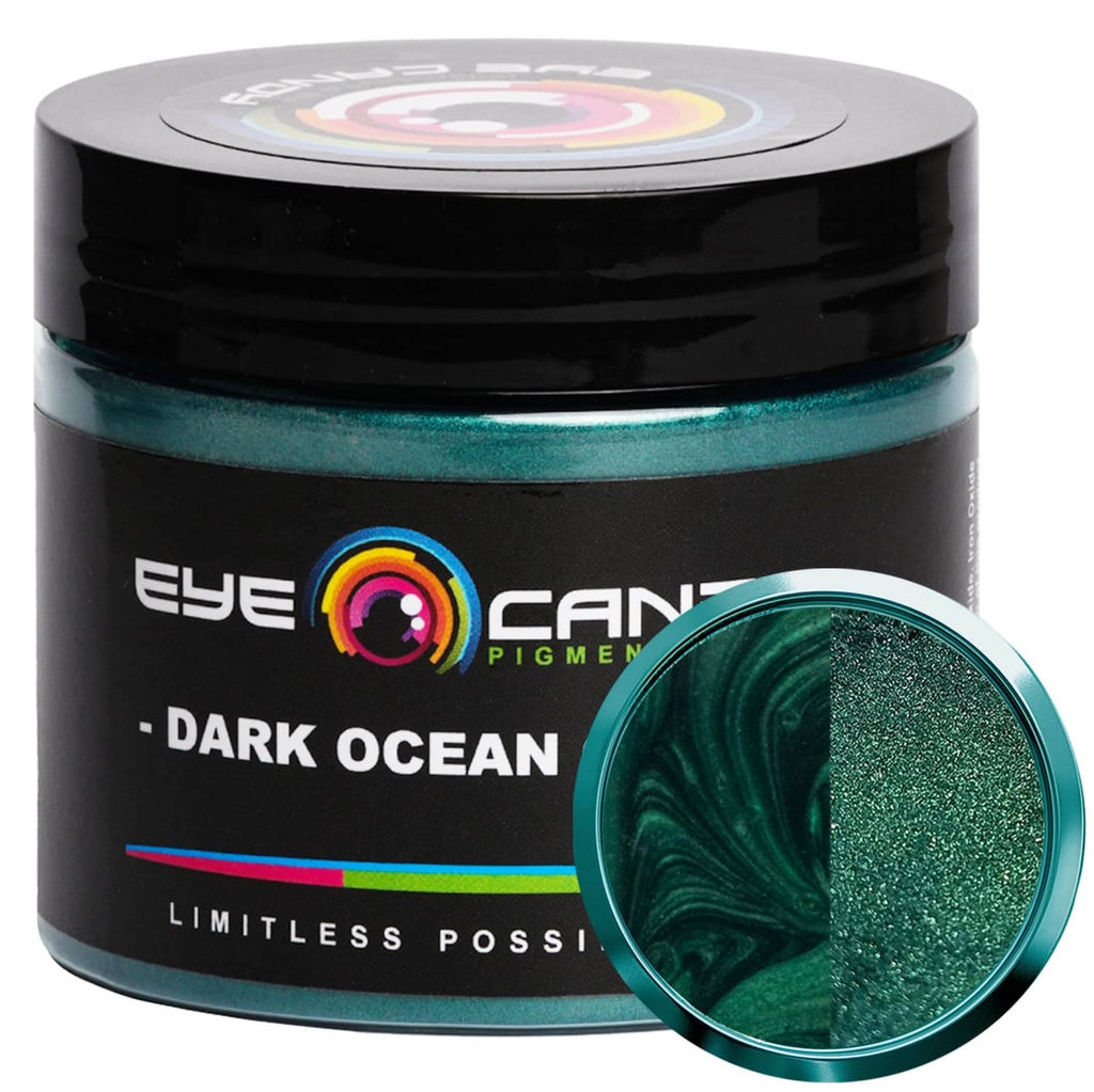 Dark green mica powder jar with black lid and teal shimmer powder highlight