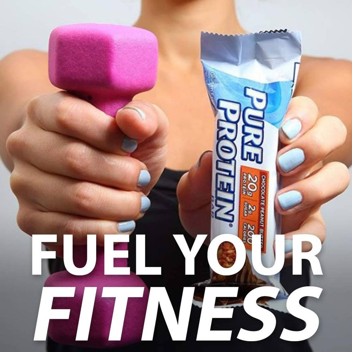 Protein bar held in hand with chocolate peanut butter wrapper