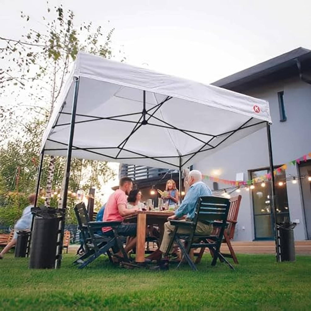 White canopy replacement top on metal frame over outdoor dining setup