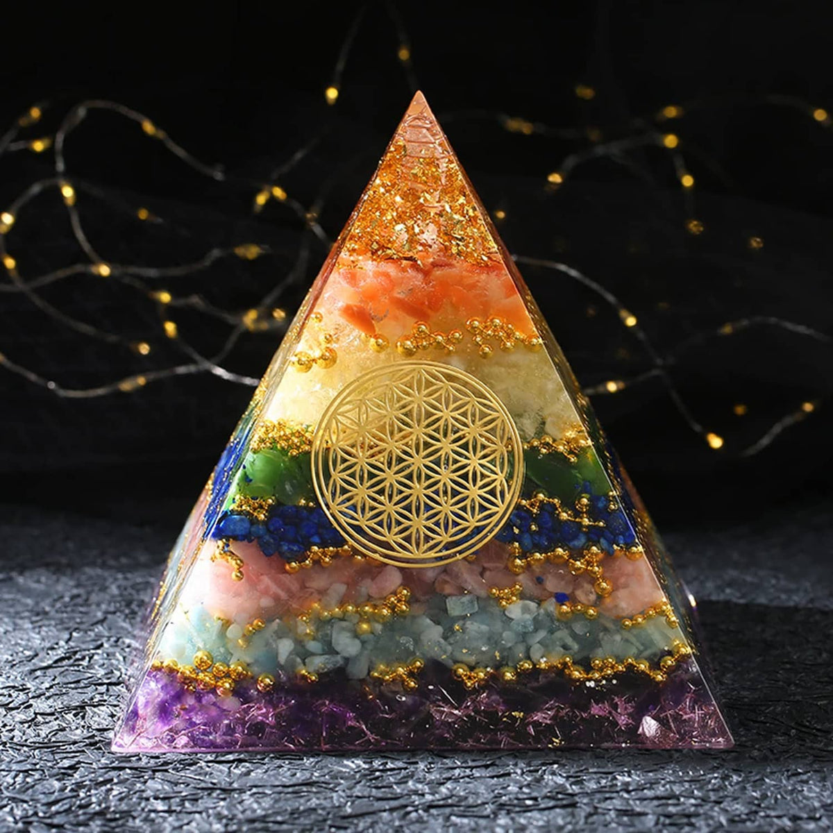 Orange, gold, and blue pyramid resin casting with gold flower design in clear mold