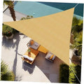Triangle sun shade sail in sand beige permeable mesh, stretched over patio seating