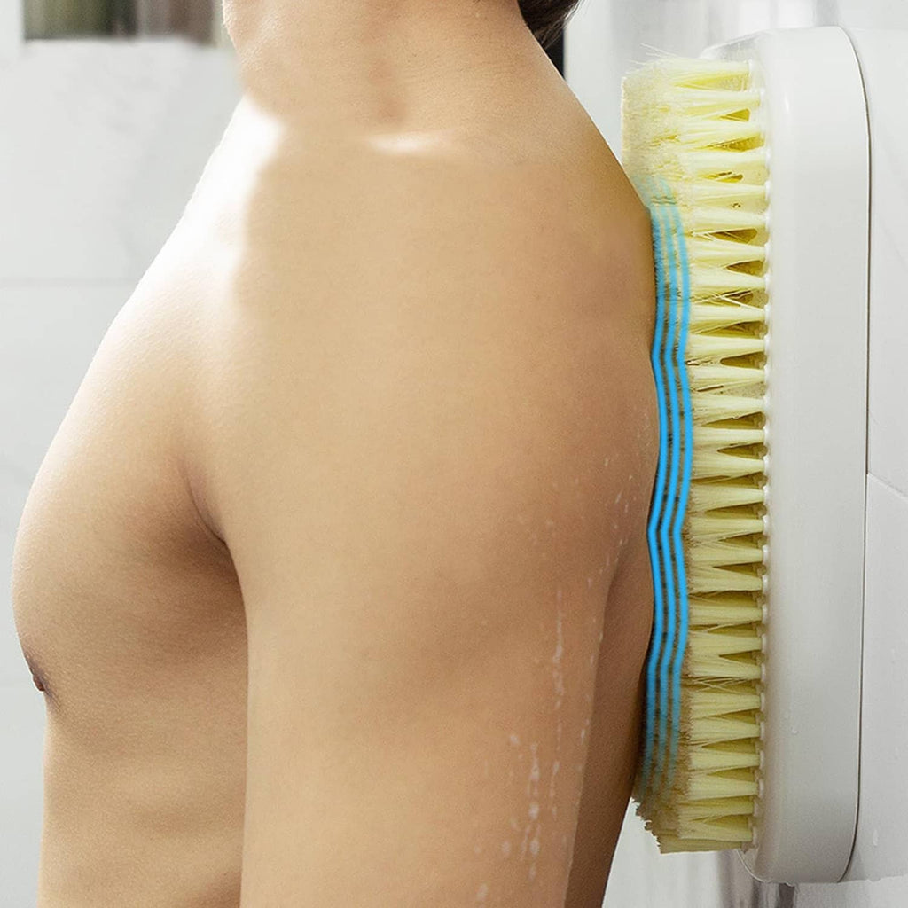 Wall-mounted back scrubber used on upper back; yellow bristle pad on white mount