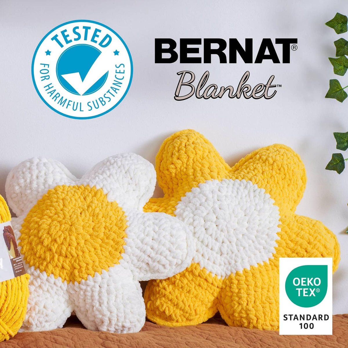 Bernat Blanket yarn skeins in white, yellow, and other colors with Oeko-Tex seal