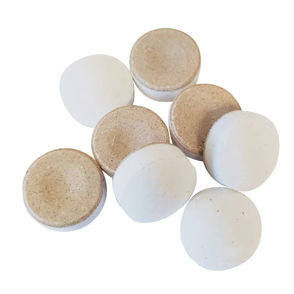 Assorted XyliMelts dry mouth dissolvable discs in tan and white colors