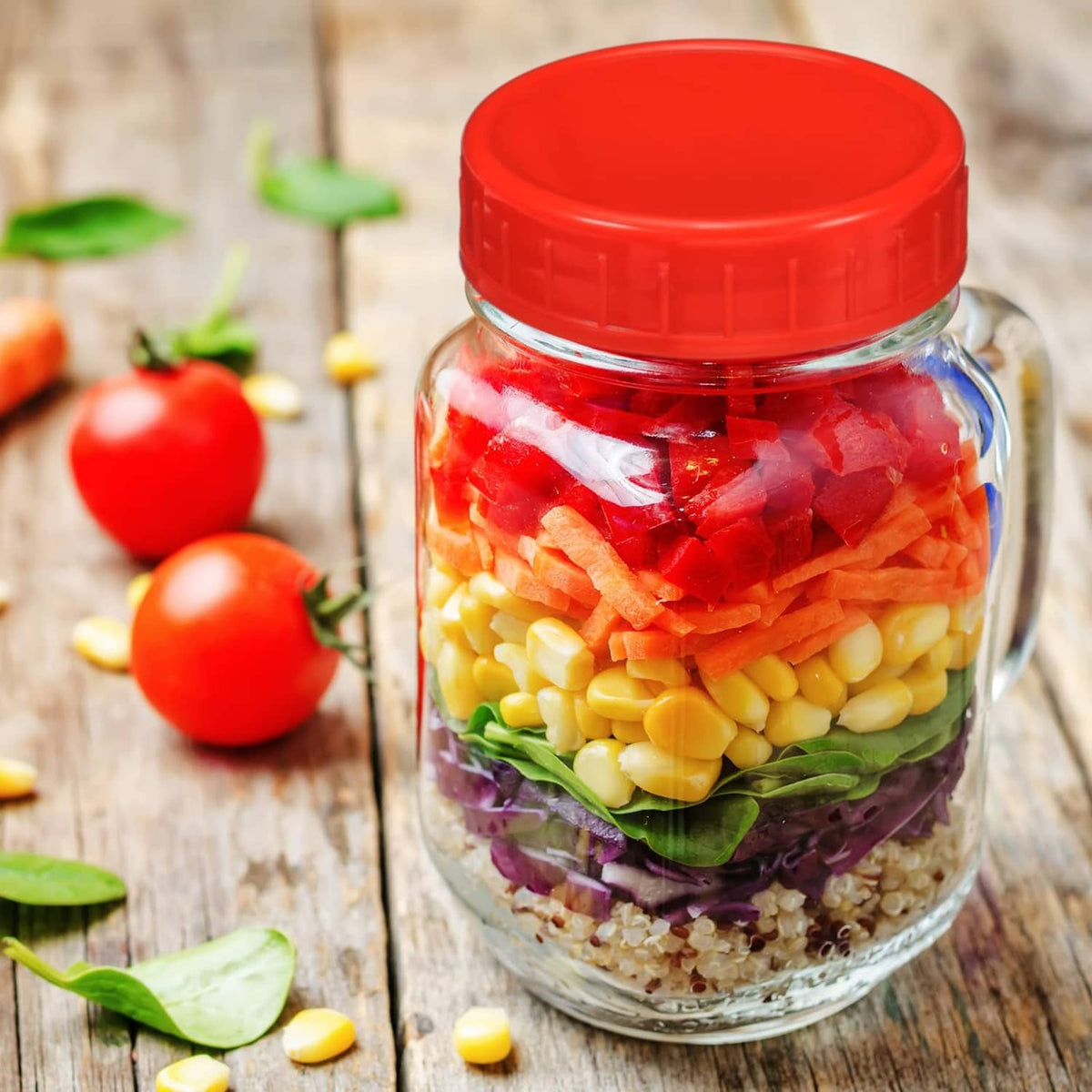Glass mason jar with red plastic lid and visible jar contents