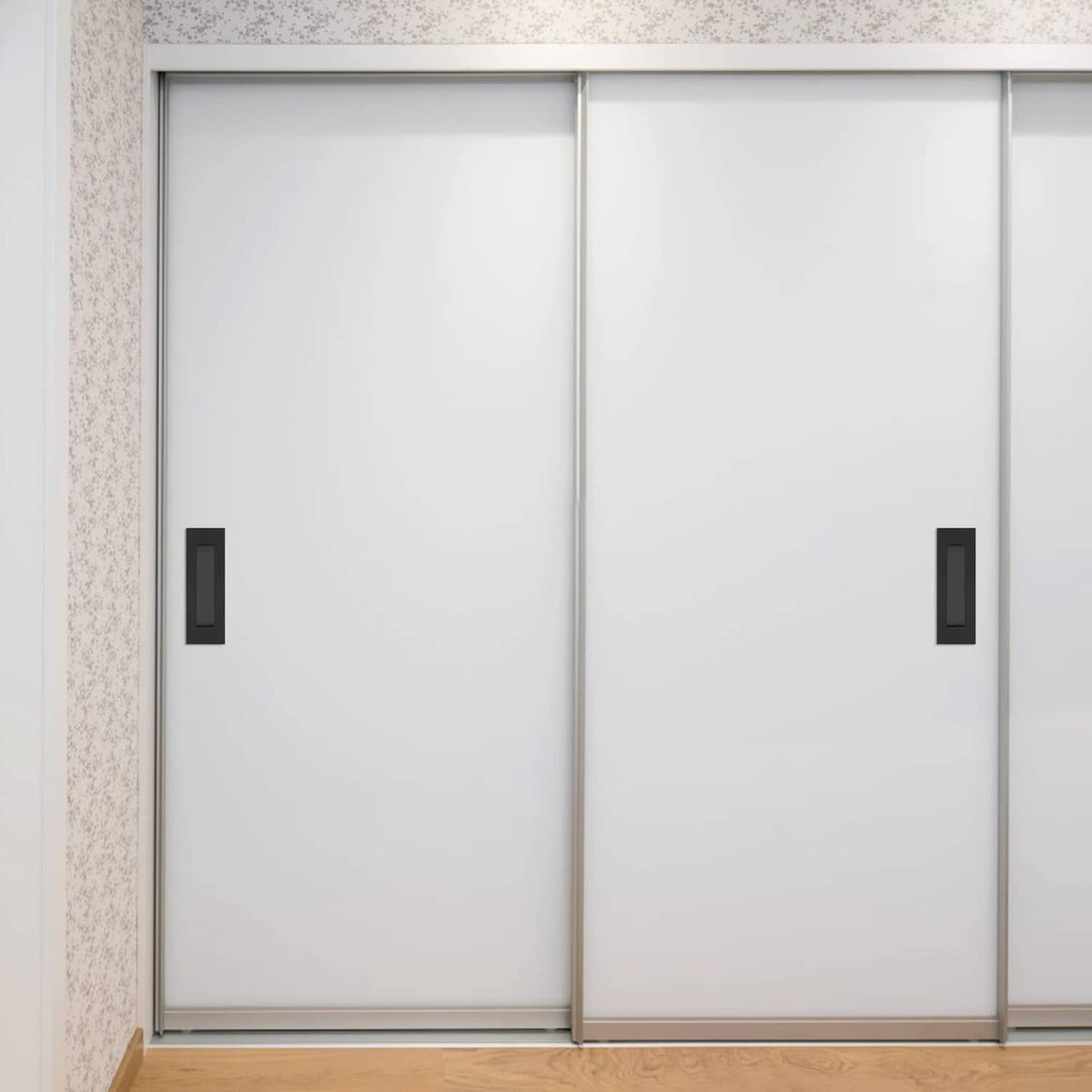 Matte black recessed finger flush pull handles on white double door