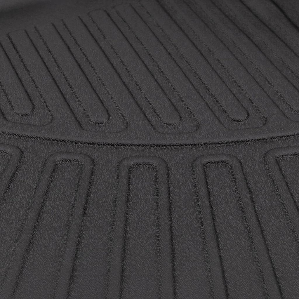 Black cargo liner tread close-up with raised ridges and textured drainage channels
