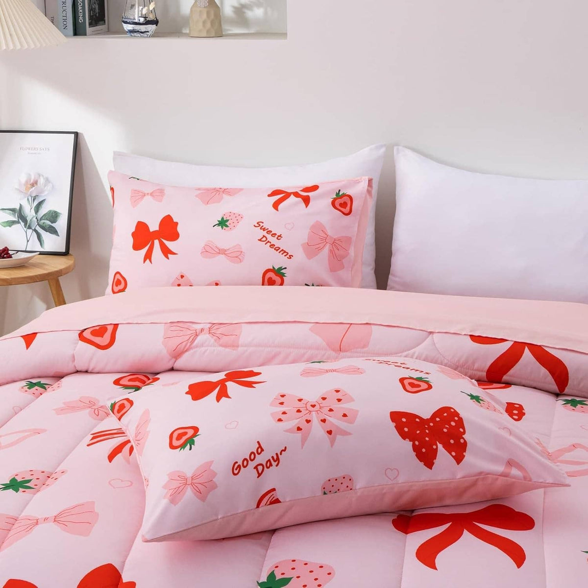 Close-up of pink comforter set with bow print and matching pillowcase