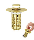 Matte gold bathroom sink stopper with flat round cap and cylindrical filter basket