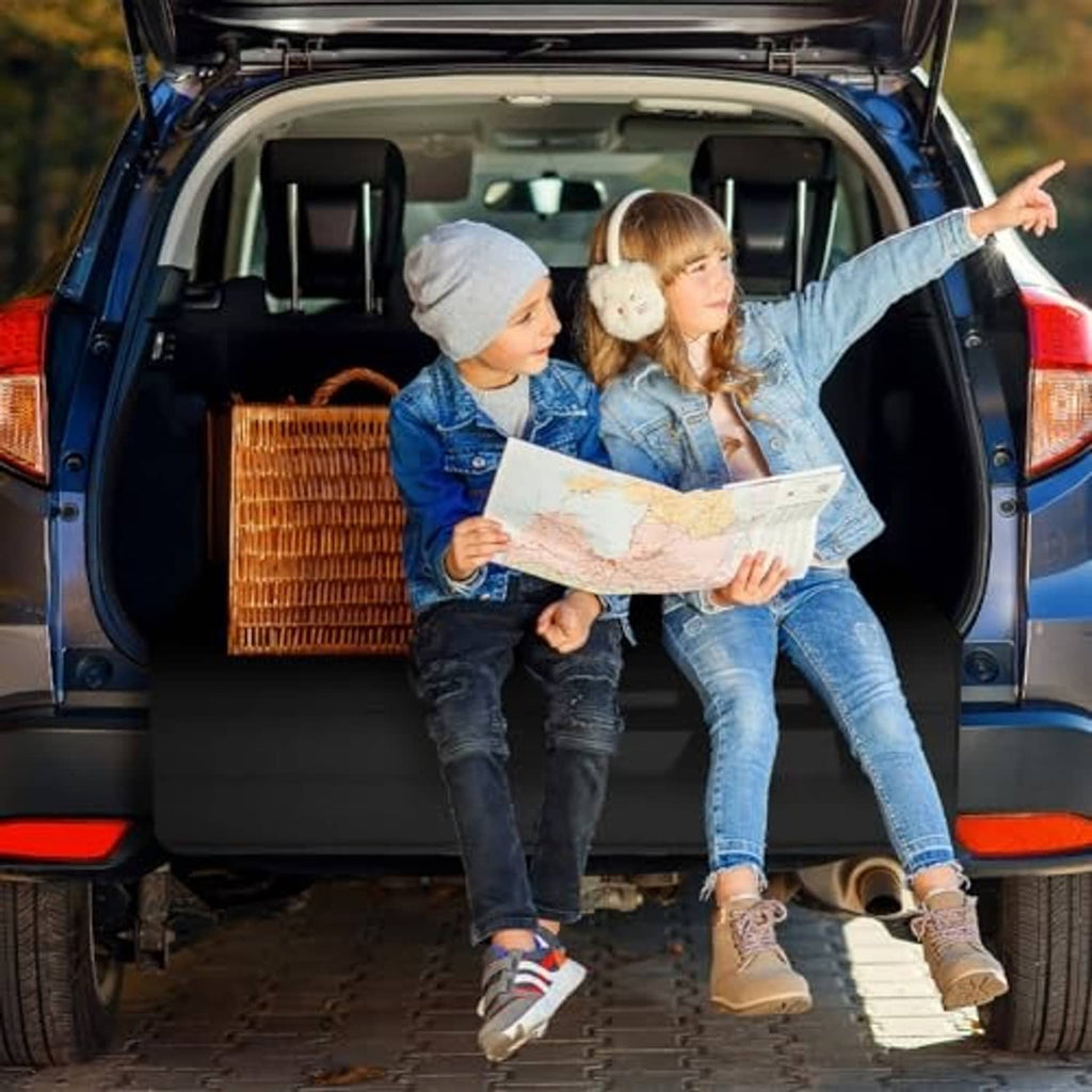 Black trunk bumper pad placed in open car trunk cargo area