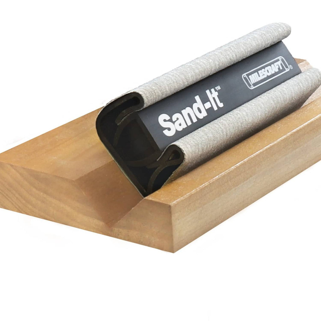 Milescraft Sand-It multi-surface sanding block on wood plank, gray sleeve and black frame