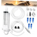 Brake bleeder kit components: 100 mL syringe, clear hose, metal fittings, blue adapters