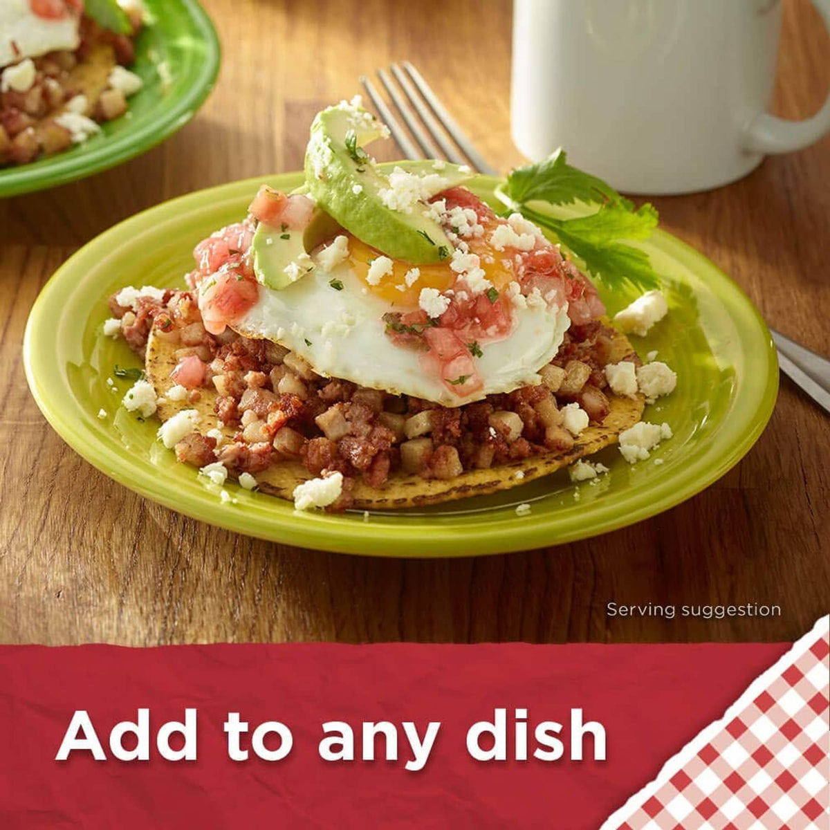 Roast beef hash plate with poached egg, shredded cheese, and herbs