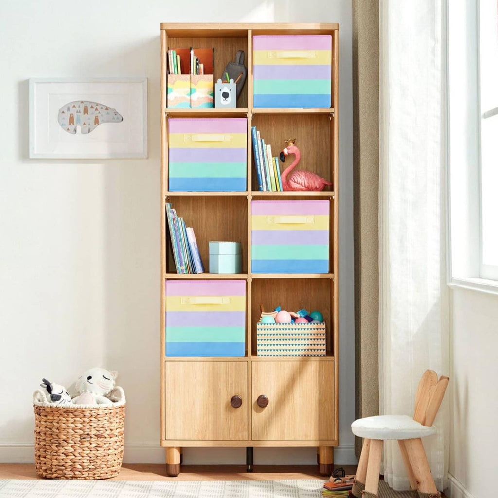 Rainbow fabric storage cubes in a tall wooden cabinet for toy and book storage