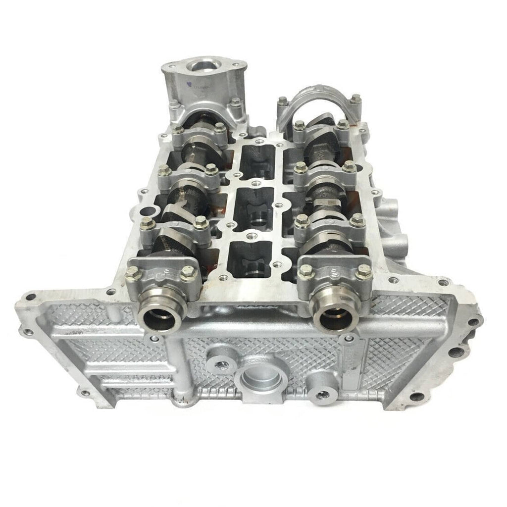 Cylinder head assembly with camshafts, rocker components, and mounting sections