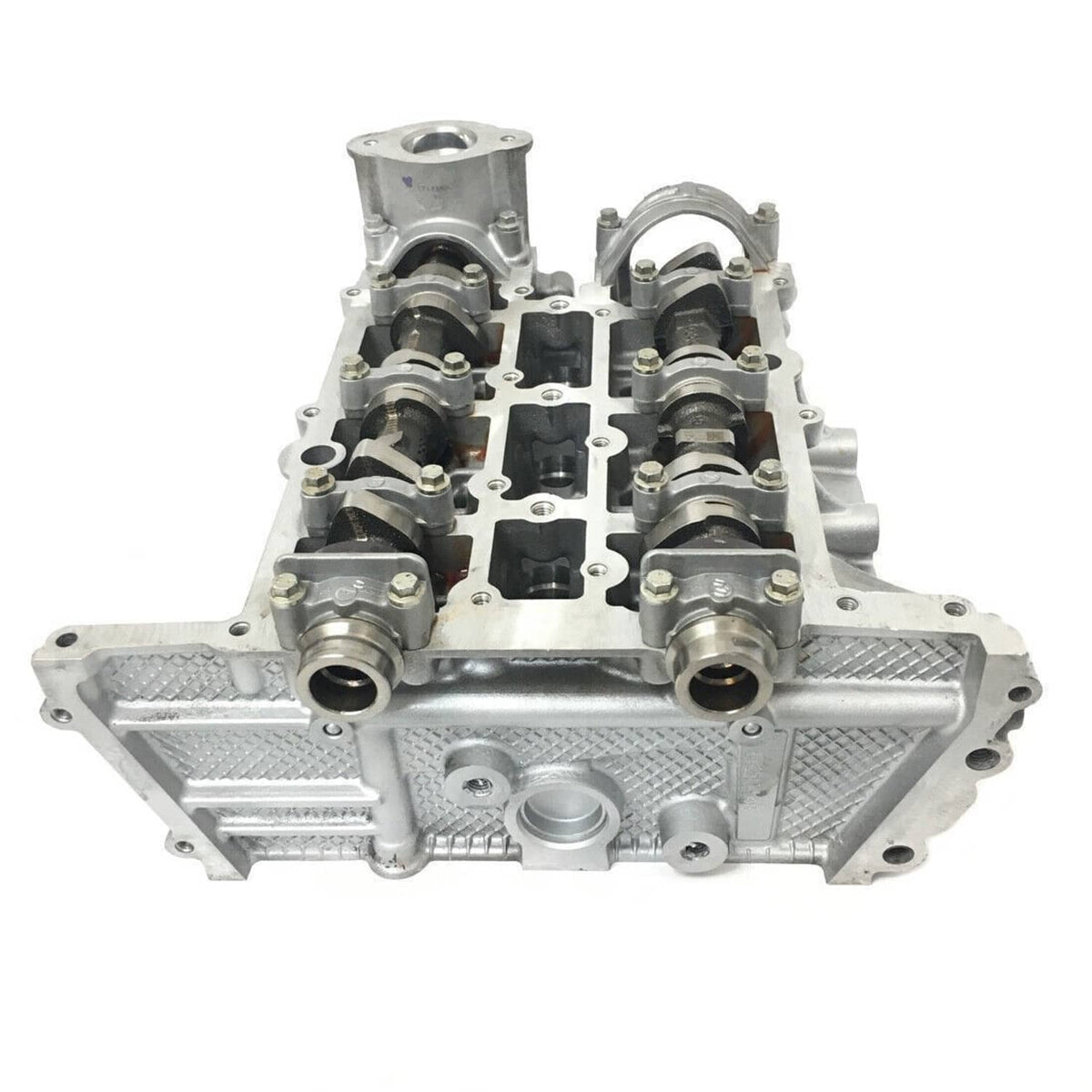Cylinder head assembly with camshafts, rocker components, and mounting sections