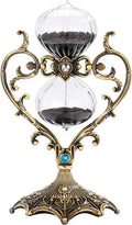 Antique brass and clear rotating hourglass timer with blue gem and dark sand