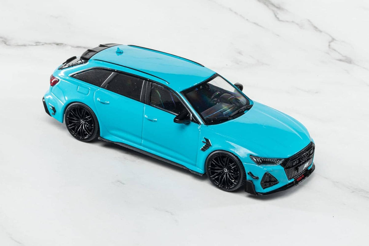 Blue ABT-tuned Audi RS6 die-cast model car, angled side view with black wheels