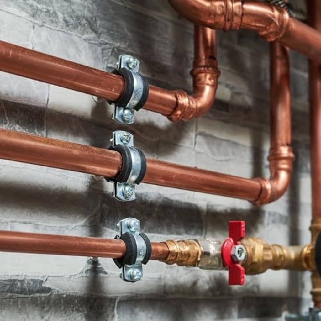 Split ring pipe hangers fastening copper pipes with galvanized brackets