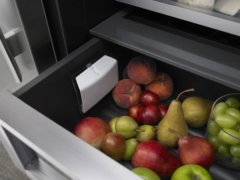White produce preserver in refrigerator crisper drawer with mixed fruit