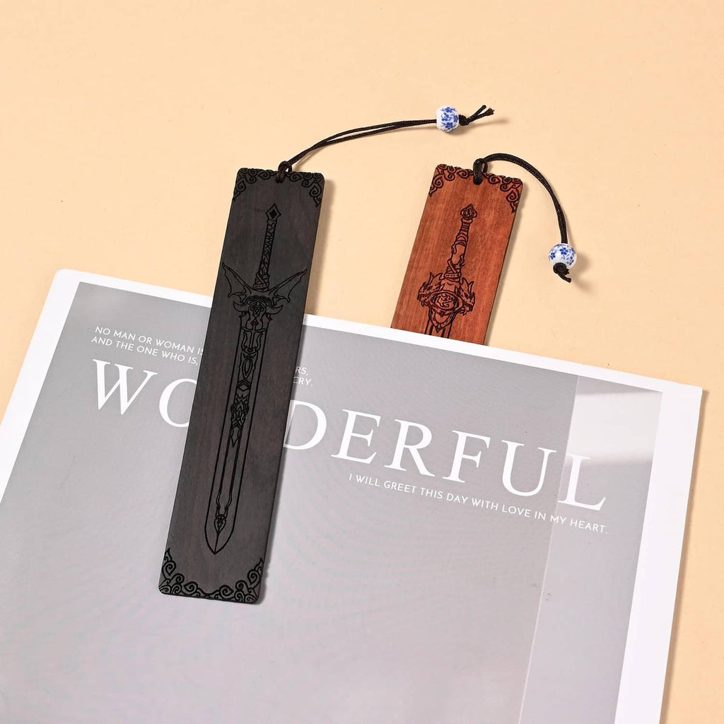 Two sword bookmarks with bead cords on greeting cards, black and brown sword motifs