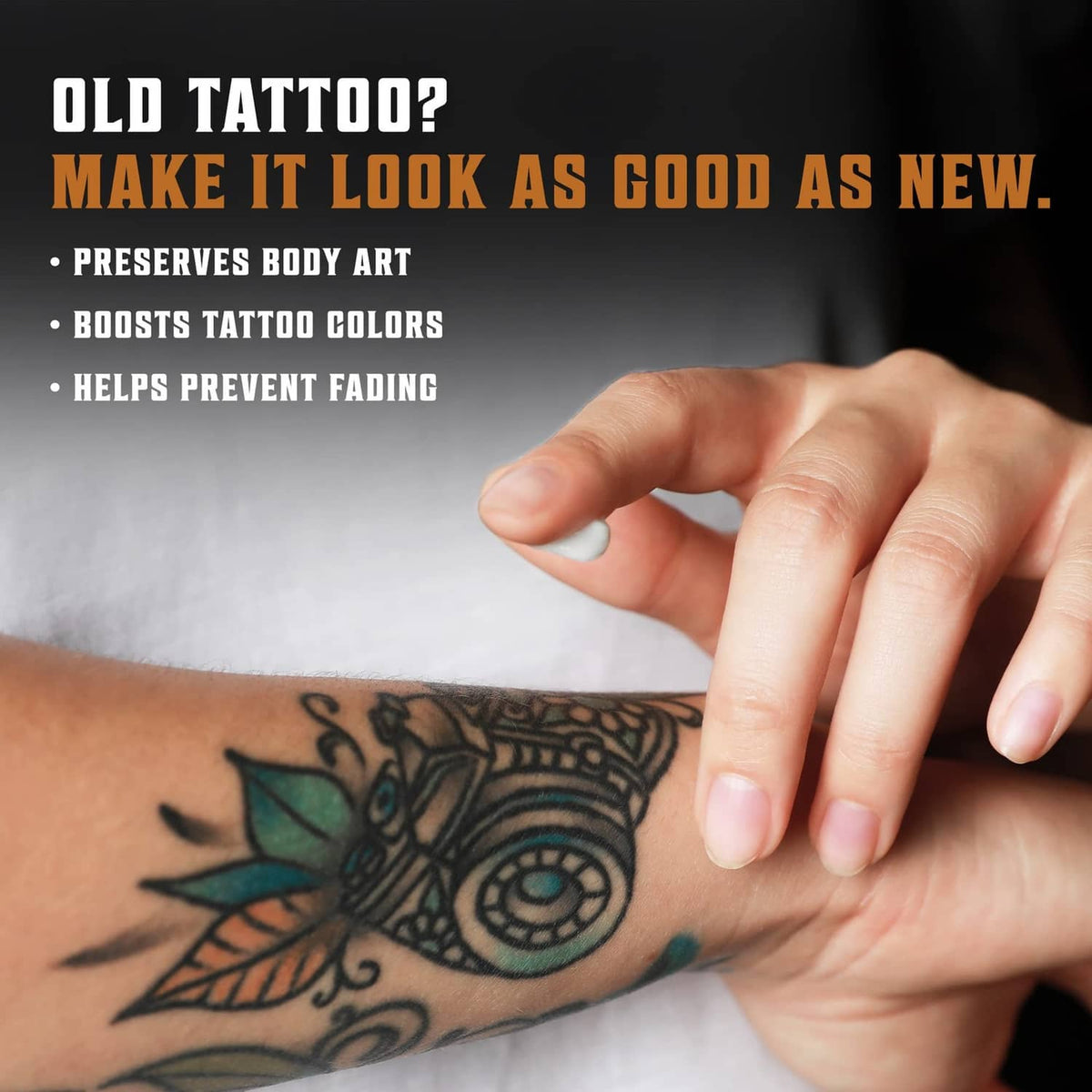 Viking Revolution tattoo care balm rubbed onto forearm tattoo, visible hand spreading balm