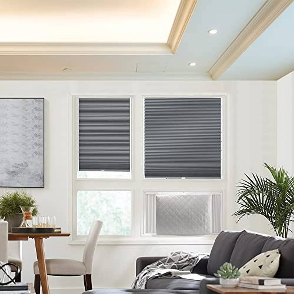 Light gray quilted air conditioner cover installed over window unit