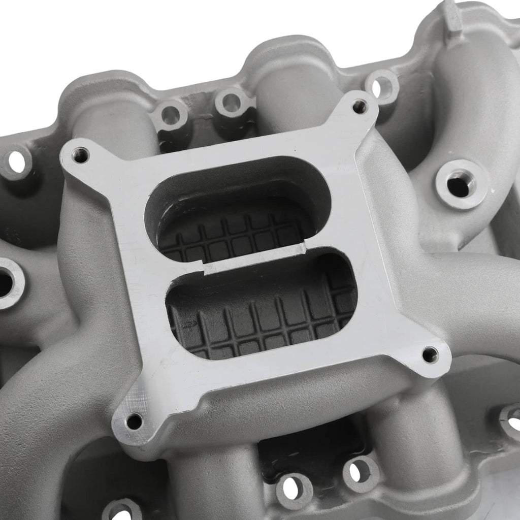 Close-up of grey intake manifold center plate with two black air inlet openings