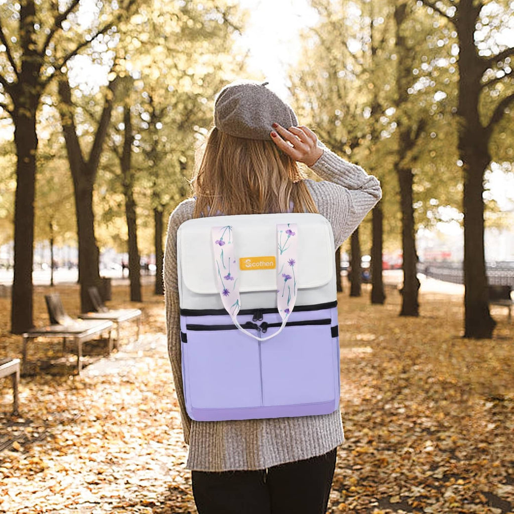Light purple insulated backpack cooler worn on back with adjustable shoulder straps