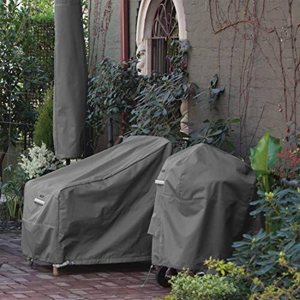 Two dark gray square air conditioner covers with smooth top panels outdoors