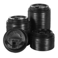 Black plastic coffee cup lids, 80mm size, with sip openings and vent tops, stack of lids