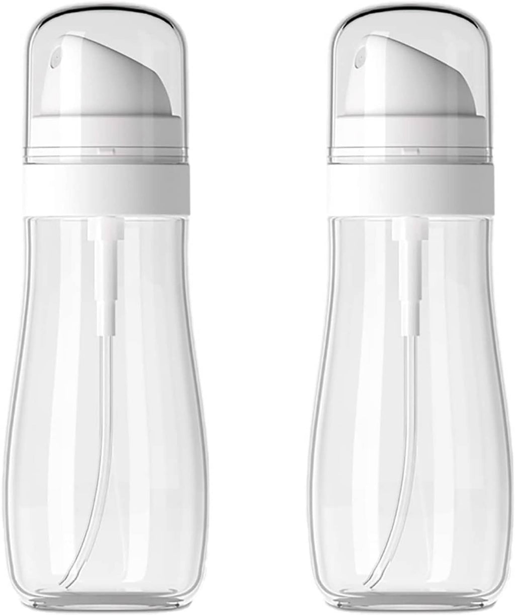 Two small transparent spray bottles with white pump tops