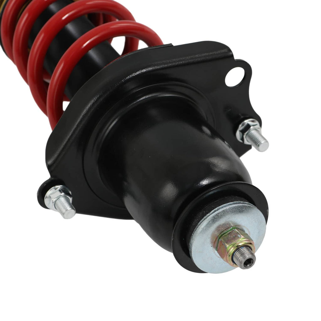 Black strut housing with red coil spring and bolt-in top cap
